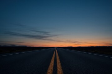 Naklejka premium Open asphalt highway at twilight with glowing horizon and dramatic evening clouds