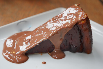 Delicious chocolate cake slice with rich ganache drizzle