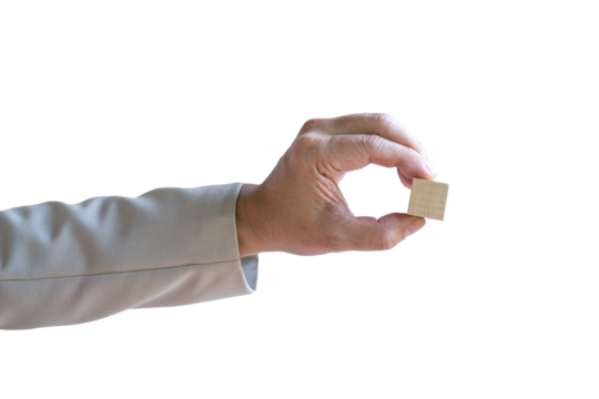 Businessman holding a piece of blank square wood block. Isolated on transparent background.