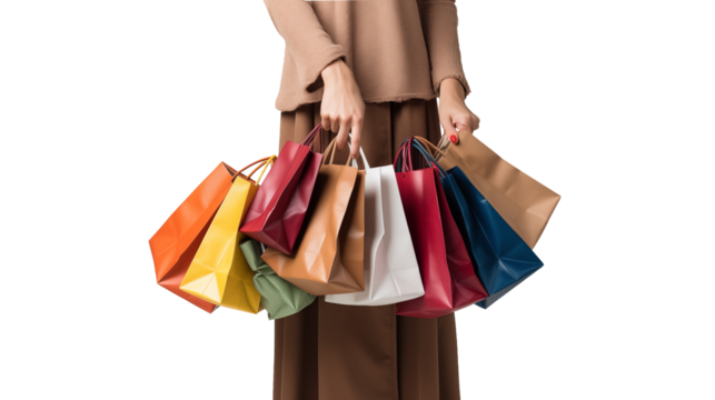Woman overloaded with shopping bags, including red paper ones, showcasing the thrill of festive season shopping, cut out.