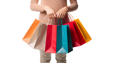 Woman overloaded with shopping bags, including red paper ones, showcasing the thrill of festive season shopping, cut out.
