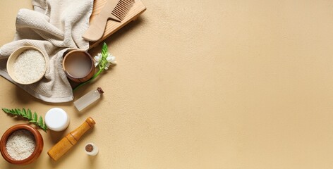 Rice water, comb and bath supplies on beige background with space for text, top view