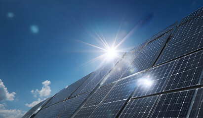Solar panels gleam under bright sun against clear blue sky, showcasing renewable energy and sustainable technology on a sunny day.