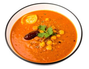 Bowl of chickpea curry with lemon and spices. Isolated transparent background