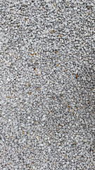 Granite stone texture background with uniformly crushed grains suitable for flooring, symbolizing durability,