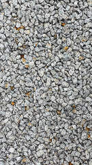 Granite stone texture background with uniformly crushed grains suitable for flooring, symbolizing durability,