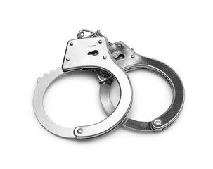 Metal handcuffs on grey background, closeup