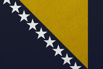 A symbolic representation displays bold colors in a textured background, showcasing stars aligned...