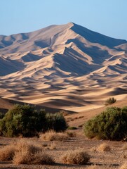 Naklejka premium Majestic Tan Mountain Range in a Desert at Sunrise