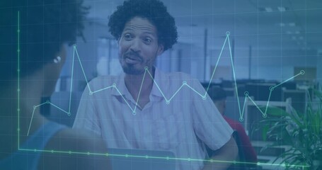 Man leaning forward during business meeting activating transparent line graph overlay showing data - Powered by Adobe