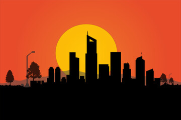 Obraz premium City Silhouette at Sunset: The captivating outline of a modern city against the dramatic backdrop of a fiery sunset, representing urban life and the beauty of dusk.