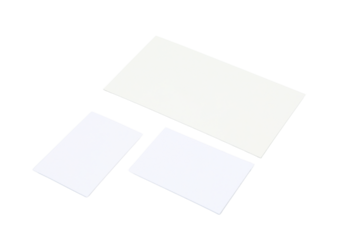 Three blank white cards of varying sizes, isolated on white, PNG