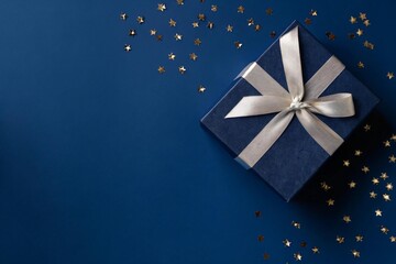 Elegant navy gift box with shimmering gold stars for birthdays and special occasions, perfect for holiday promotions, corporate gifting, or adding a touch of luxury to your designs