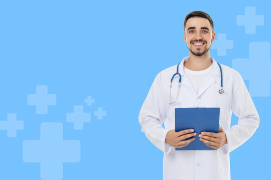 Doctor smiles at the camera with clipboard in hand