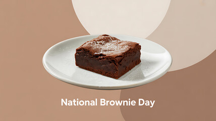 A chocolate brownie on a white plate celebrating National Brownie Day