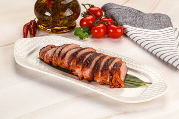 Sliced duck breast baked with cherry
