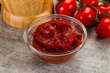 Red tomato paste in the bowl