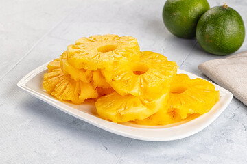 Sweet canned pineapple slices in syrope
