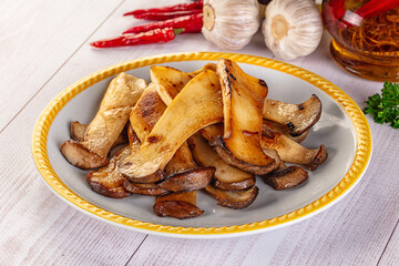 Roasted eringi mushrooms in the plate