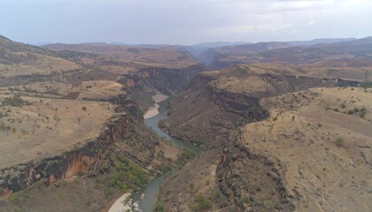 River carving through arid canyon landscape