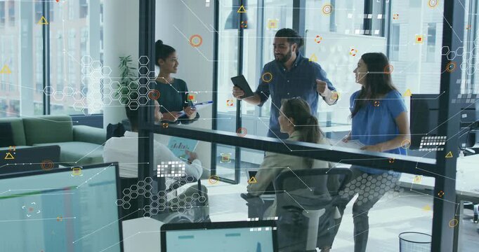 Presenter tapping tablet and gesturing on business whiteboard demo while colleagues jotting notes