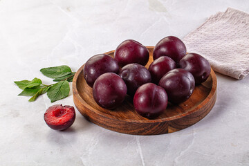Raw ripe purple plum heap