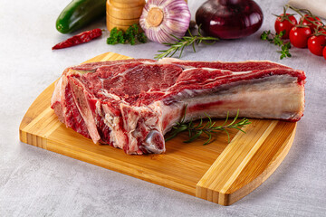 Raw prime beef steak with bone