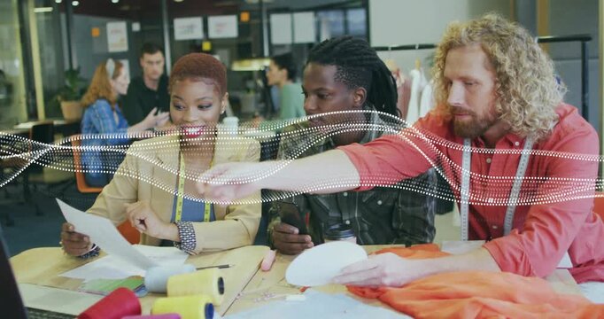 Designers starting fashion meeting by holding sketch sheet, pointing pattern and approving concept