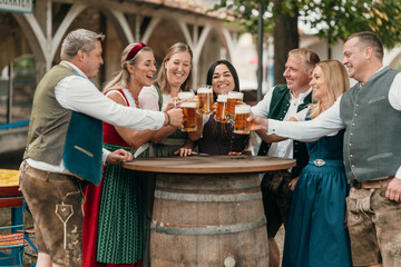 Smiling men and women friends enjoy beer mugs in Bavarian beer garden celebrating friendship leisure culture tradition and festive joy