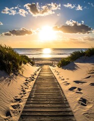Wooden boardwalk leads to a tranquil beach sunset