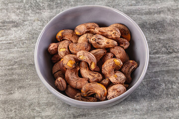Unpeeled cashew nuts in the bowl