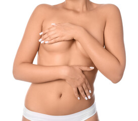 Beautiful young woman with naked breast on white background