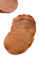 Fermented soybean discs, known as “Thua Nao,” a traditional Thai seasoning used to enhance flavor in Northern cuisine.