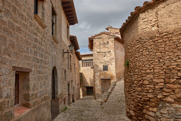 Picturesque stone alleys in the charming medieval village of Mirambel, Teruel, inviting exploration