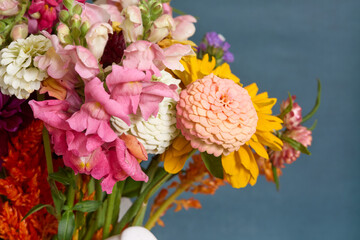 Mixed flower bouquet in white pitcher
