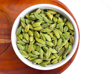 Green cardamom pods with aromatic and medicinal benefits.