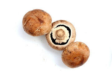 Fresh portobello mushrooms with visible gills underneath.