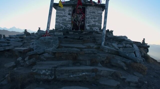 Chandrashila Temple set against the breathtaking Himalayan mountain range, located in Chopta, Rudraprayag district, Uttarakhand, India.