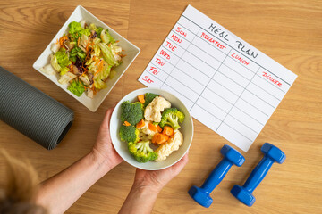 Nutrition plan and healthy diet background with meal schedule, fitness equipment, fresh vegetables and salad bowl for calorie control and healthy eating habits in daily life.