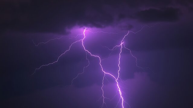 Dramatic purple lightning illuminating a stormy night sky, capturing raw natural energy.
