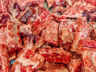 Fresh Raw Cuts of Meat on Display at a Local Market Stall