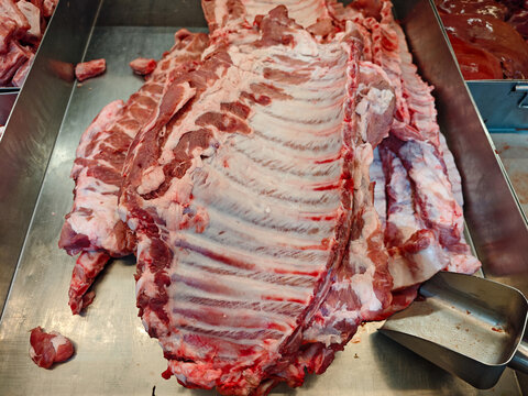 Fresh Pork Cuts on Display at Butcher Shop for Purchase and Cooking