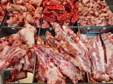 Fresh Cuts of Raw Meat Displayed at Butcher Shop