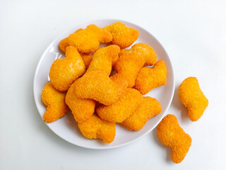 Chicken nuggets. Crunchy chicken nugget on the plate, isolated white background
