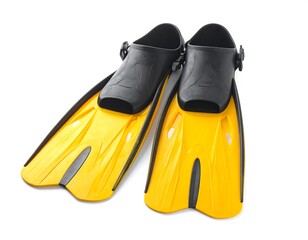 A pair of yellow and black swim fins on a white background