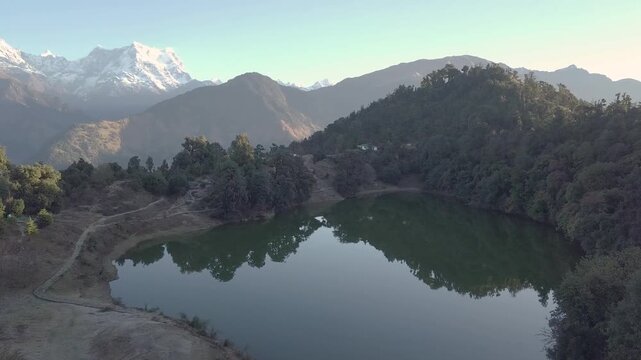 Deoriatal Lake nestled in the lap of the Garhwal Himalayas near Chopta, Uttarakhand, India. A serene high-altitude lake surrounded by lush forests and mountain views, popular for trekking and nature 