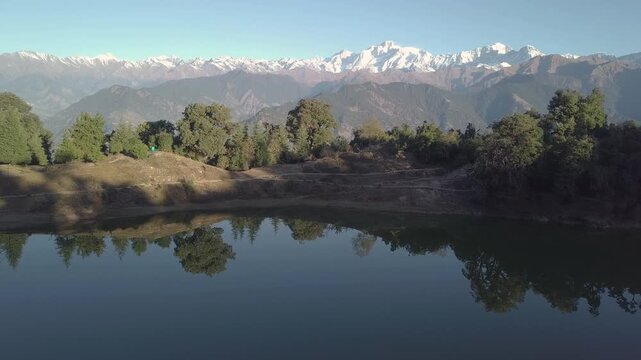 Deoriatal Lake nestled in the lap of the Garhwal Himalayas near Chopta, Uttarakhand, India. A serene high-altitude lake surrounded by lush forests and mountain views, popular for trekking and nature 