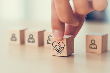 Empathy in leadership concept. Wooden block symbolizing empathy and partnership among blocks...