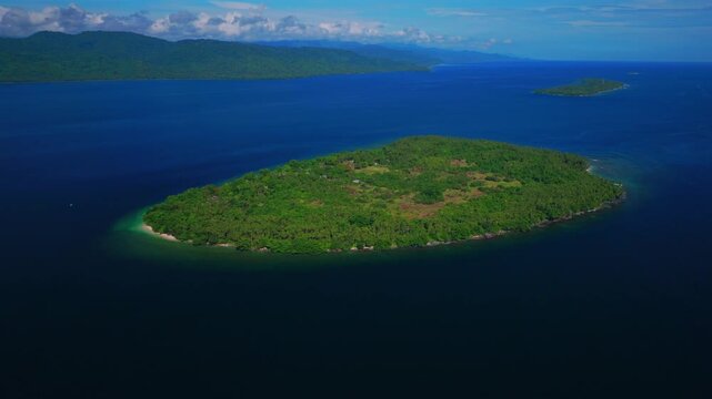 Yuo Island remote pristine untouched tropical Mushi island coastline village Madang Cape Wom Wewak Papua New Guinea aerial drone PNG dry season summer morning blue sky fishing boat forward pan up