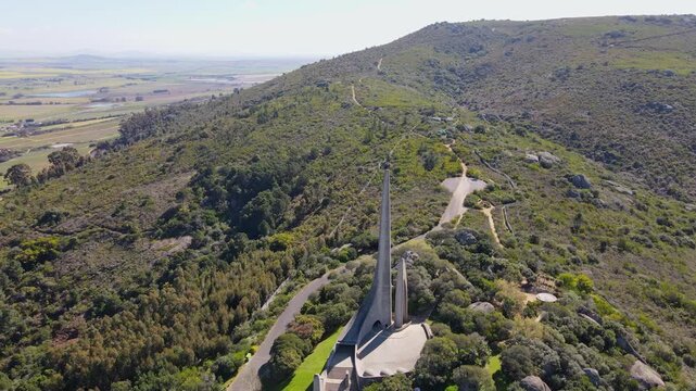 Afrikaanse Taalmonument atop Paarl mountain overlooking farm land countryside
